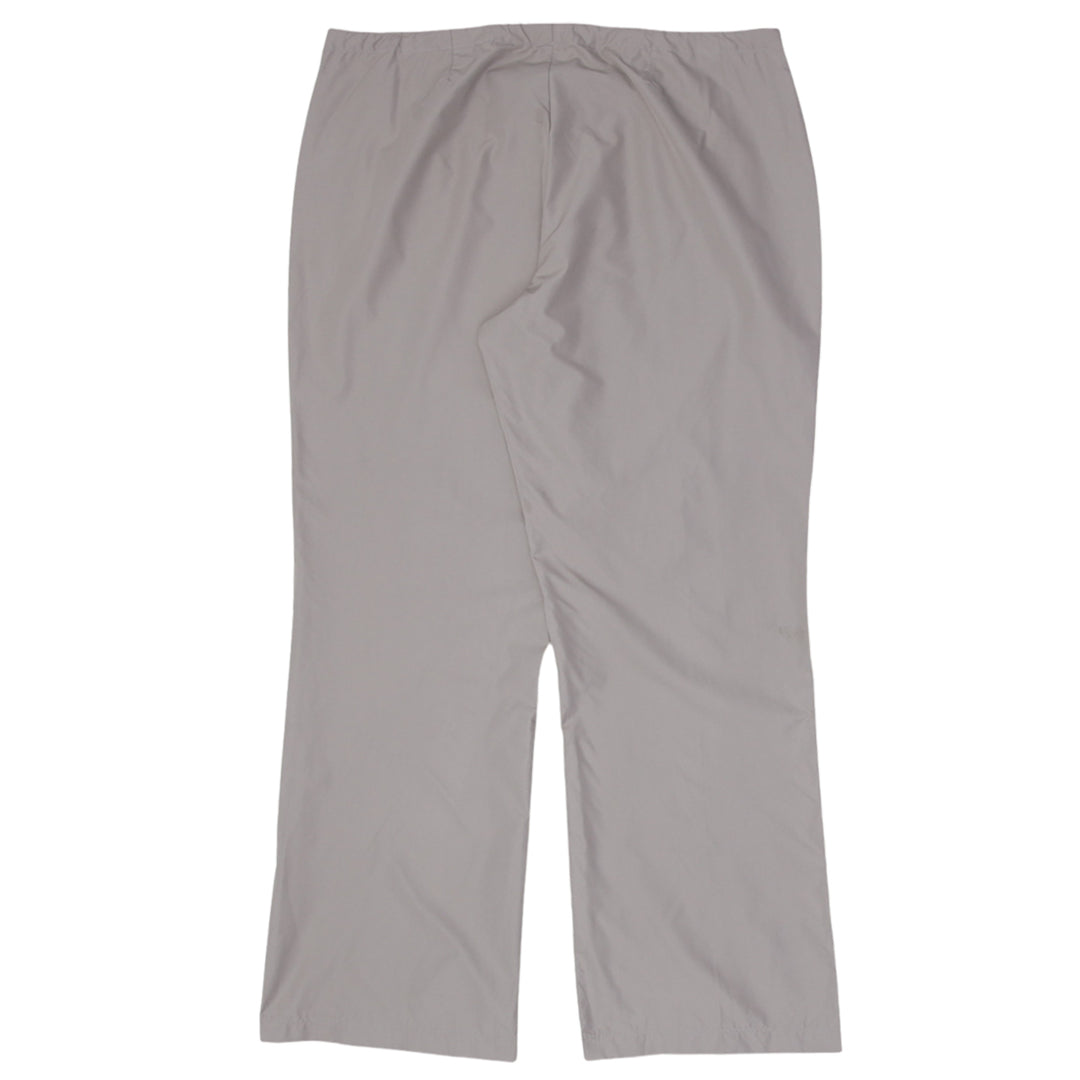 Vintage Nike Ladies Front Zip Wide Leg Track Pants featuring sporty design and retro athletic style