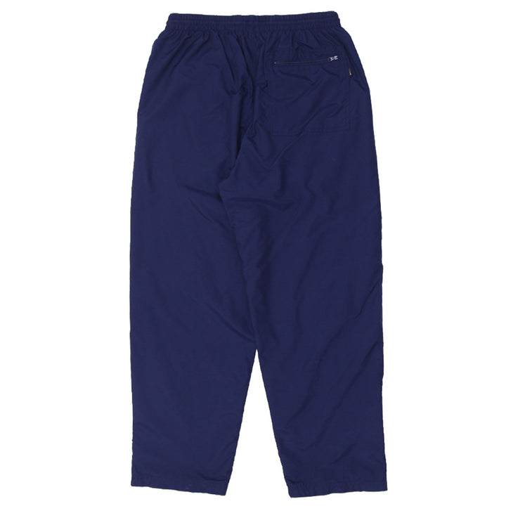 Vintage Nike nylon track pants with embroidered logo