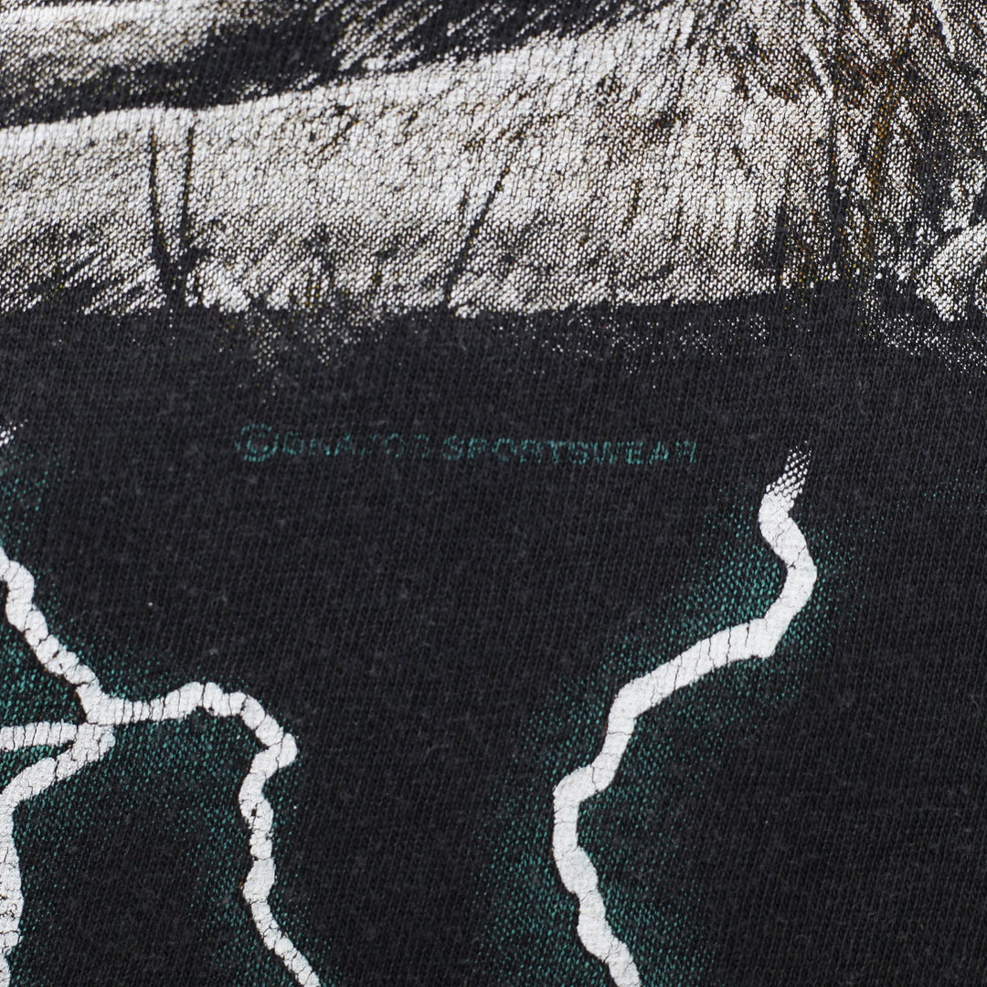 Vintage 90’s American Thunder Wolf Indian Lightning T-Shirt Size L | Migration_T-Shirts - Detail View | Fashion Rerun