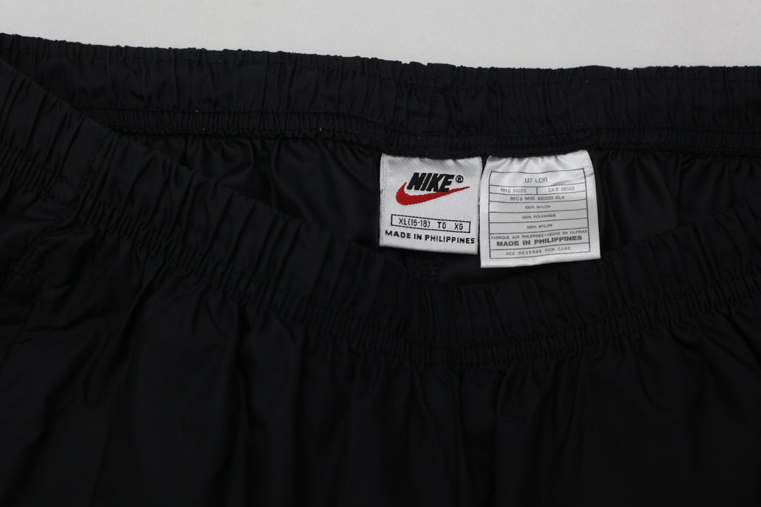 Vintage 90's Nike Black Nylon Ankle Zip Track Pants- Size XL , Youth - Fashion Rerun Vintage Migration_Pants
