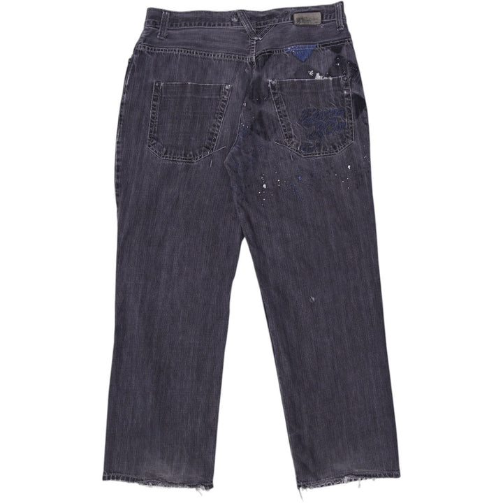 Y2K Mens Ripped Denim Worn Look Distressed Black Jeans Size 36 | Migration_Jeans & Pants - Side View | Fashion Rerun