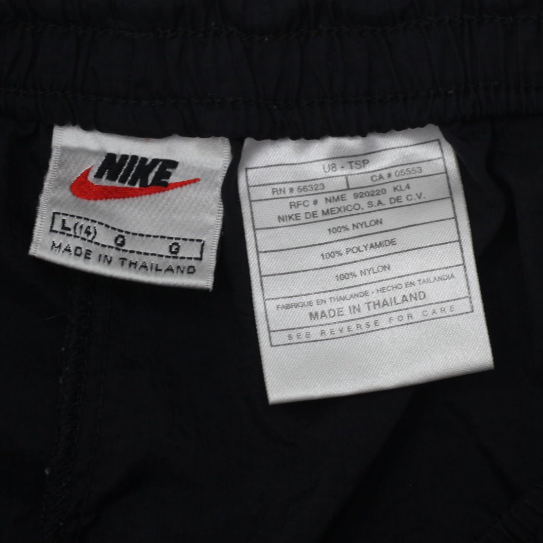 Shop 90s Vintage Nike Swoosh Embroidered Nylon Cuffed Track Pants