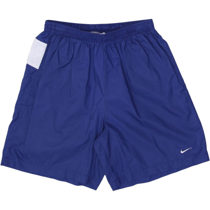 Vintage men’s Nike navy blue sports shorts with spellout logo