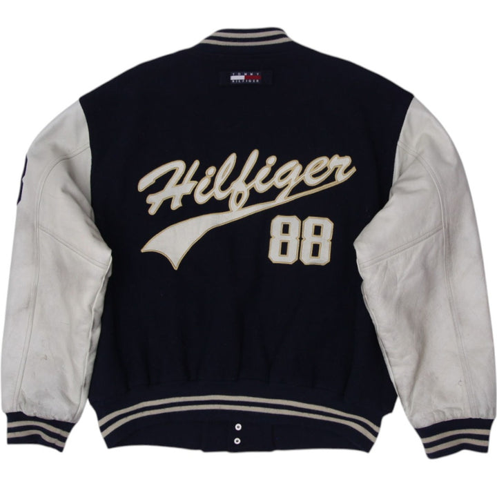 Vintage Tommy Hilfiger Varsity Jacket Navy Leather Sleeves Logo 88 XL | Migration_Jackets - Side View | Fashion Rerun